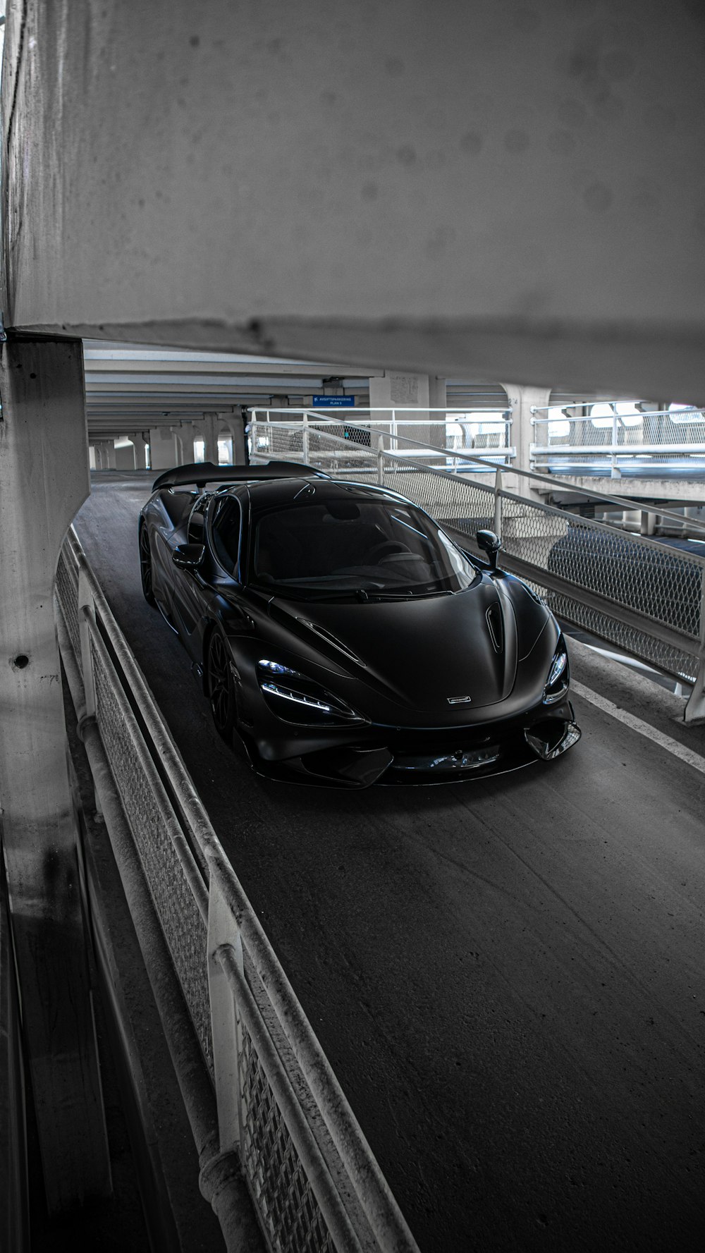 a black sports car on a race track