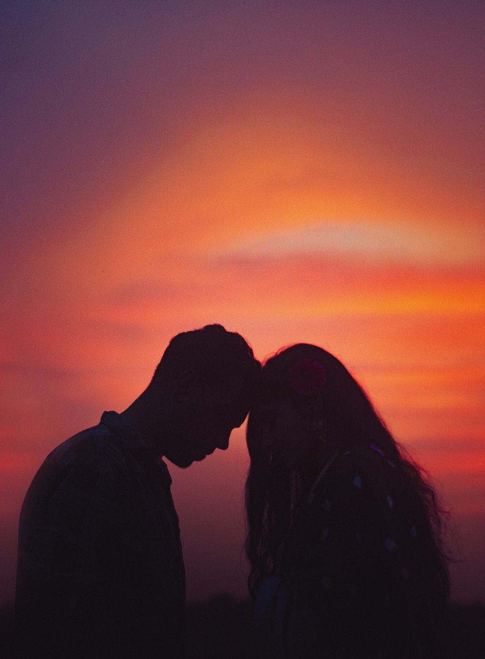 a man and woman kissing