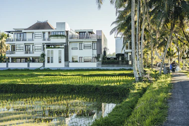 a building with a pond in front of it