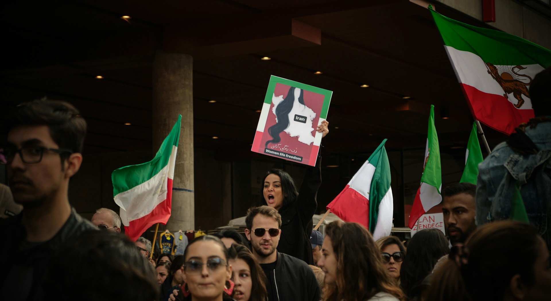 a group of people holding flags
