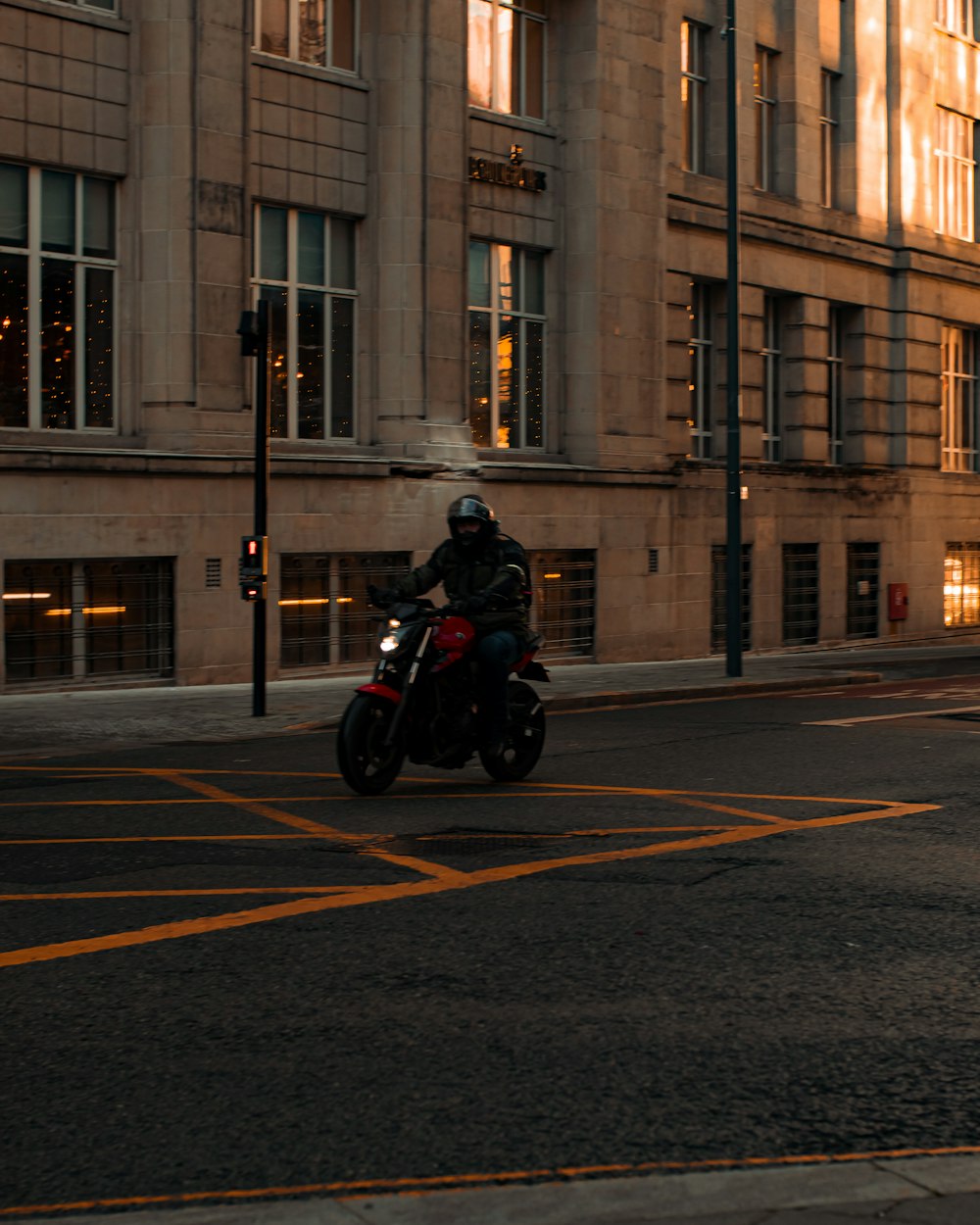 a person riding a motorcycle on the street