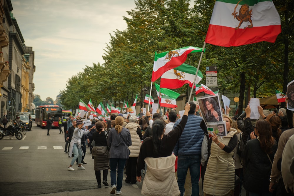 a group of people holding flags