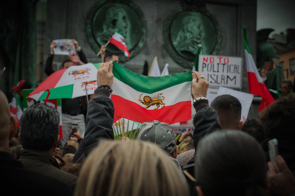 a group of people holding flags