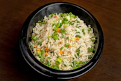a bowl of rice with vegetables