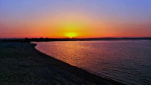 A serene sunset over a tranquil beach.