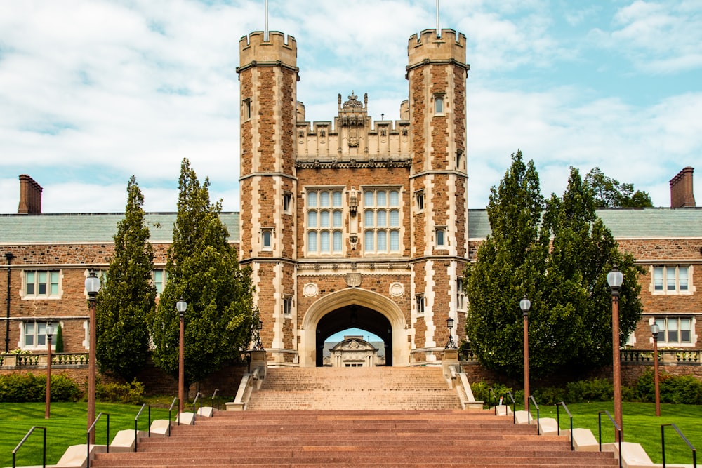 a brick building with a large arched doorway and a brick walkway