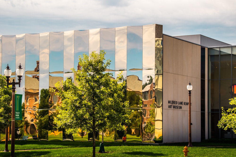 a large building with trees in front of it