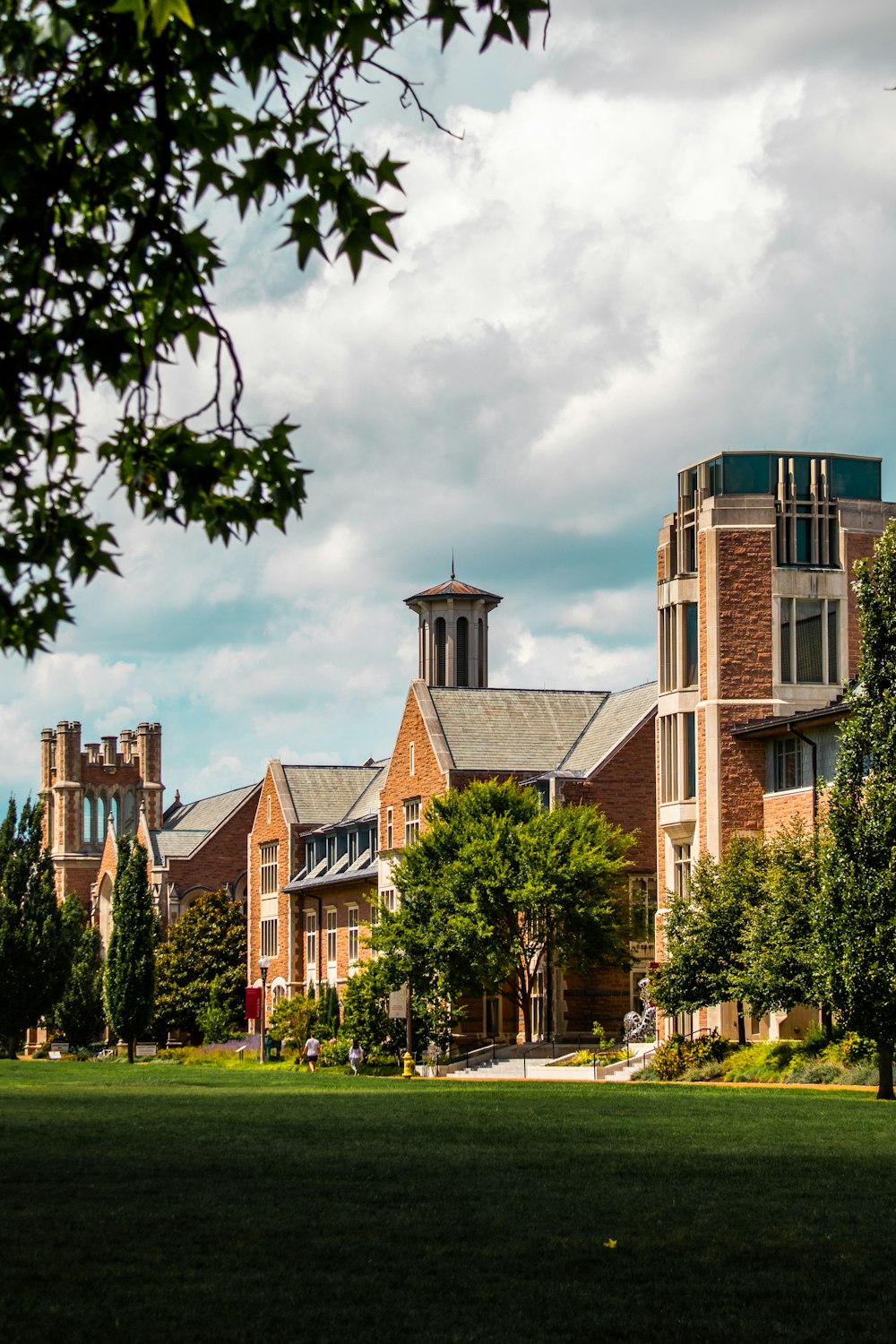 a group of buildings with trees in front of them