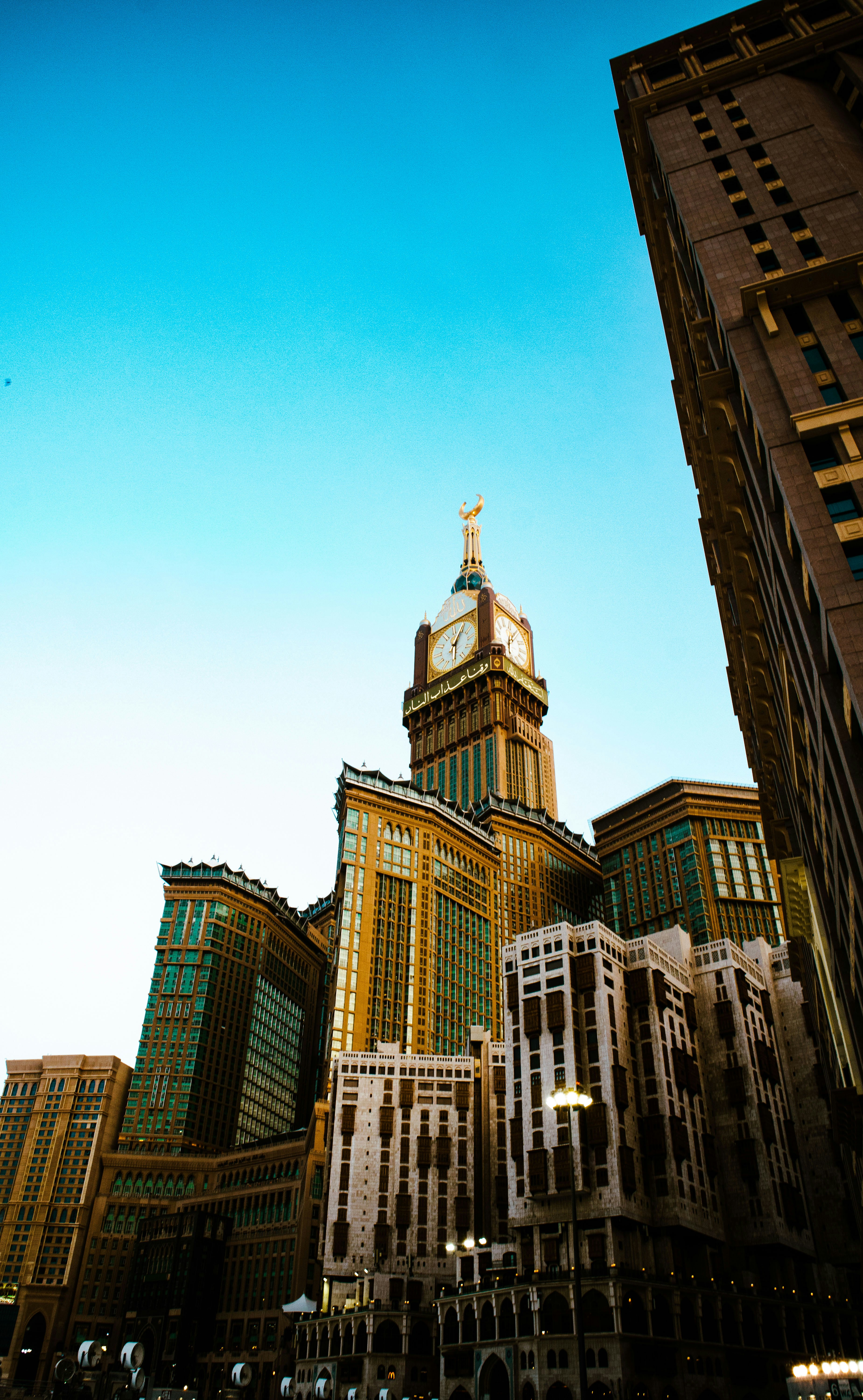 a large building towers over a city