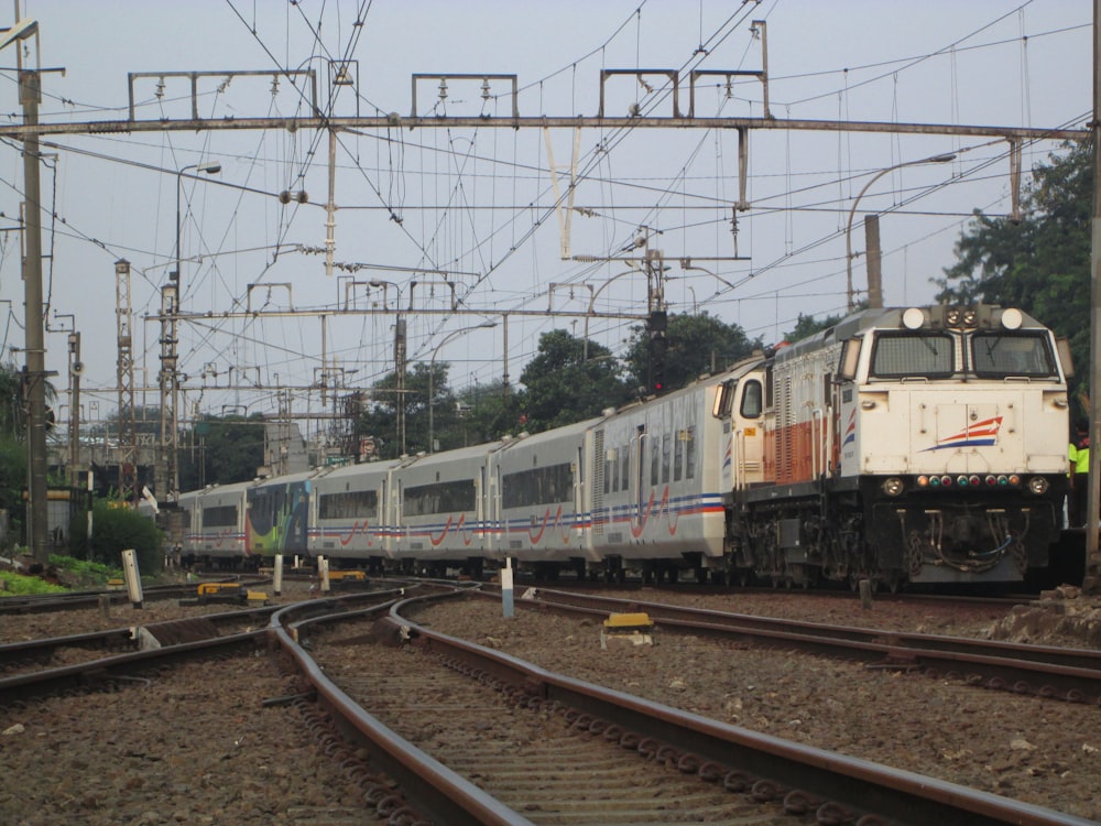 a train travels down the tracks