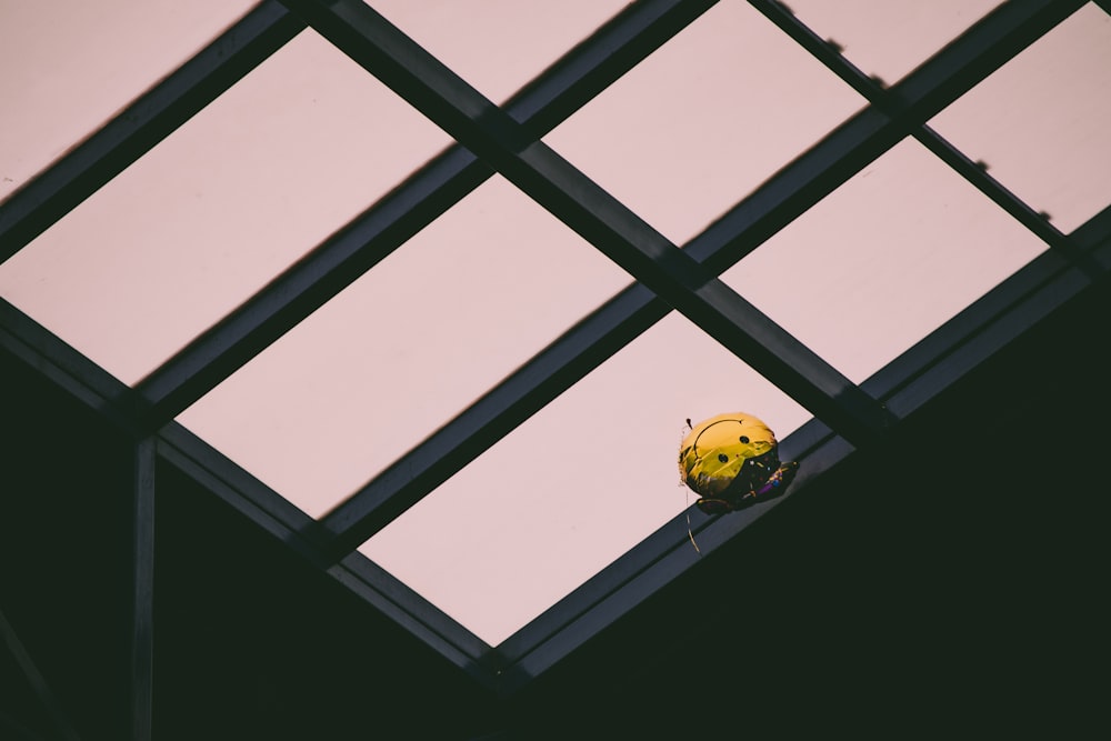 a yellow rubber duck on a metal structure