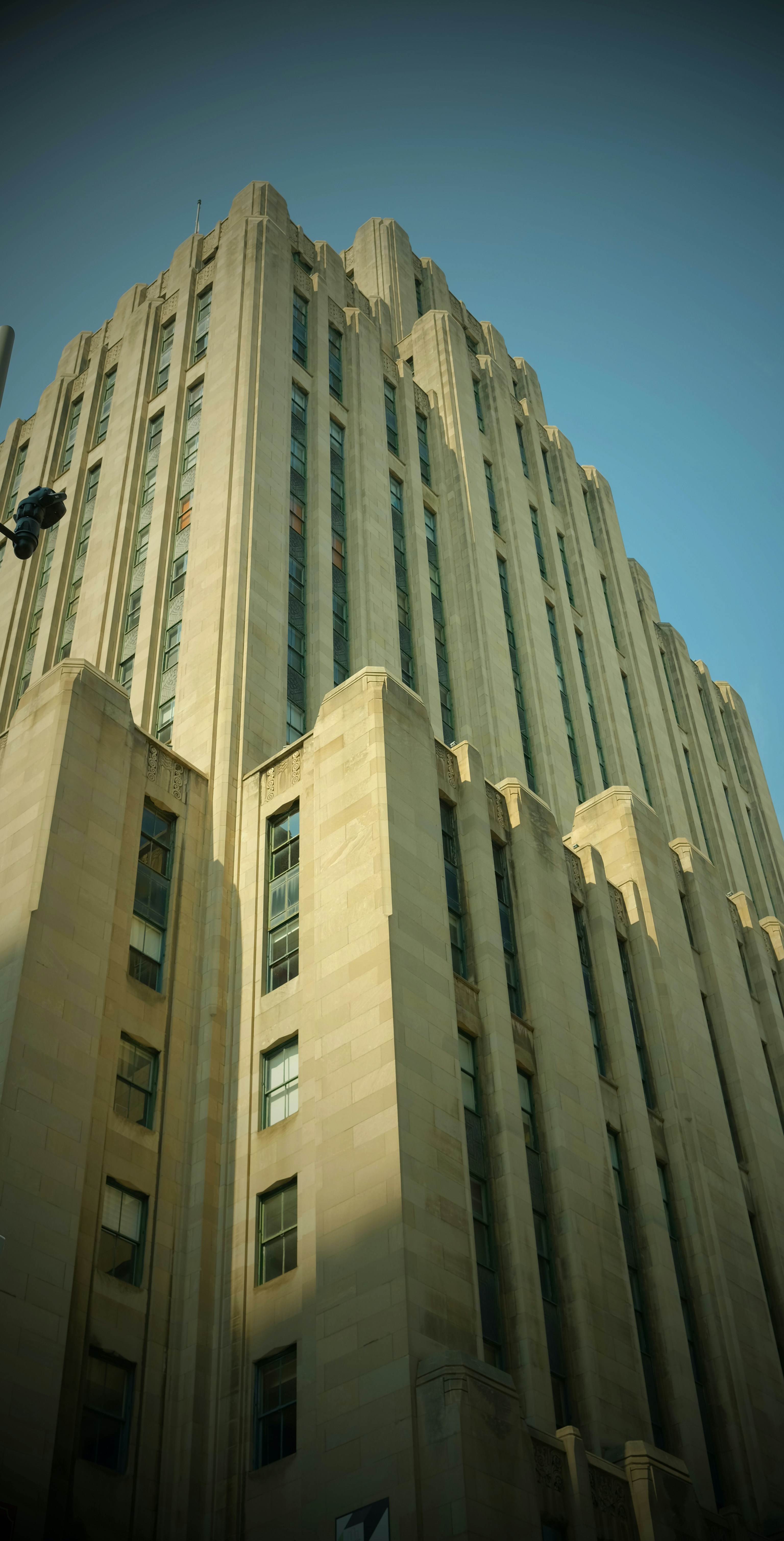 a tall building with a blue sky