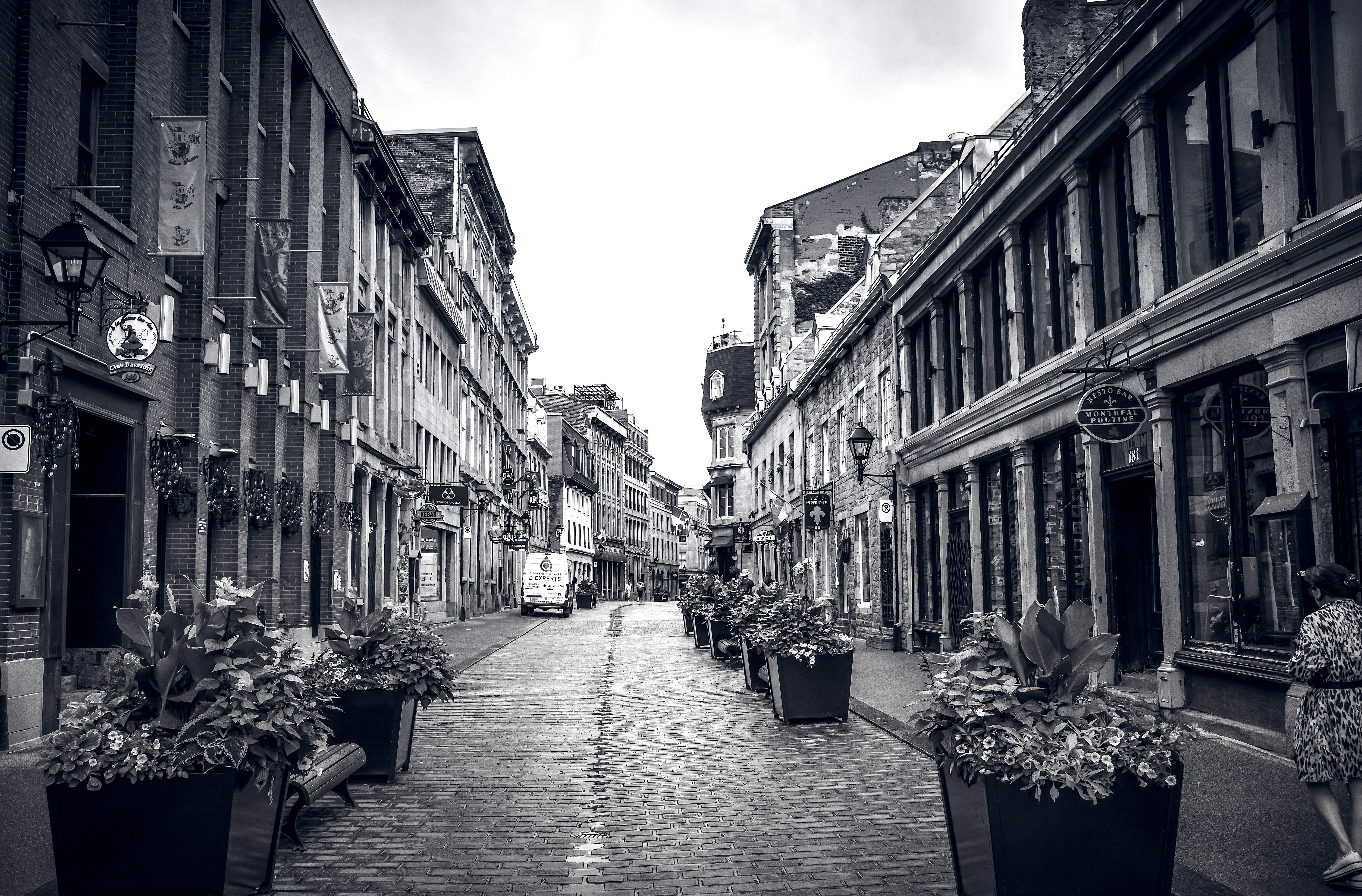 a cobblestone street with buildings on either side of it