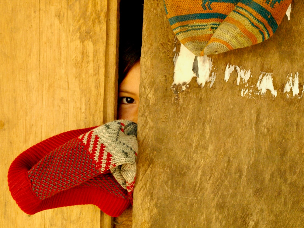 a person looking through a door