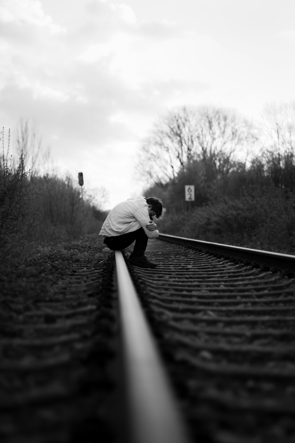 a man leaning on a rail