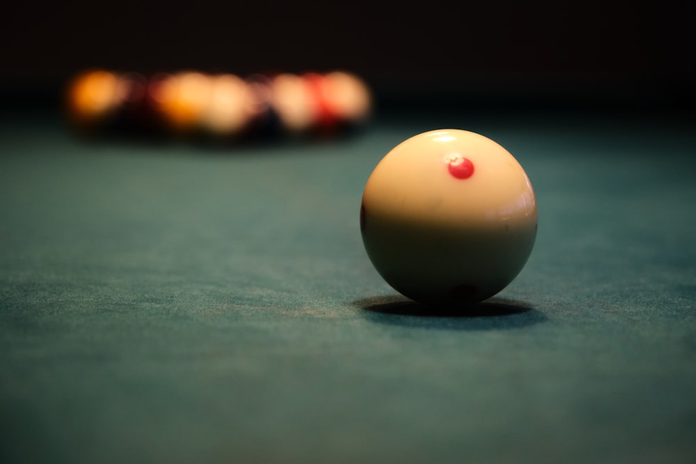a pool table with a pool ball