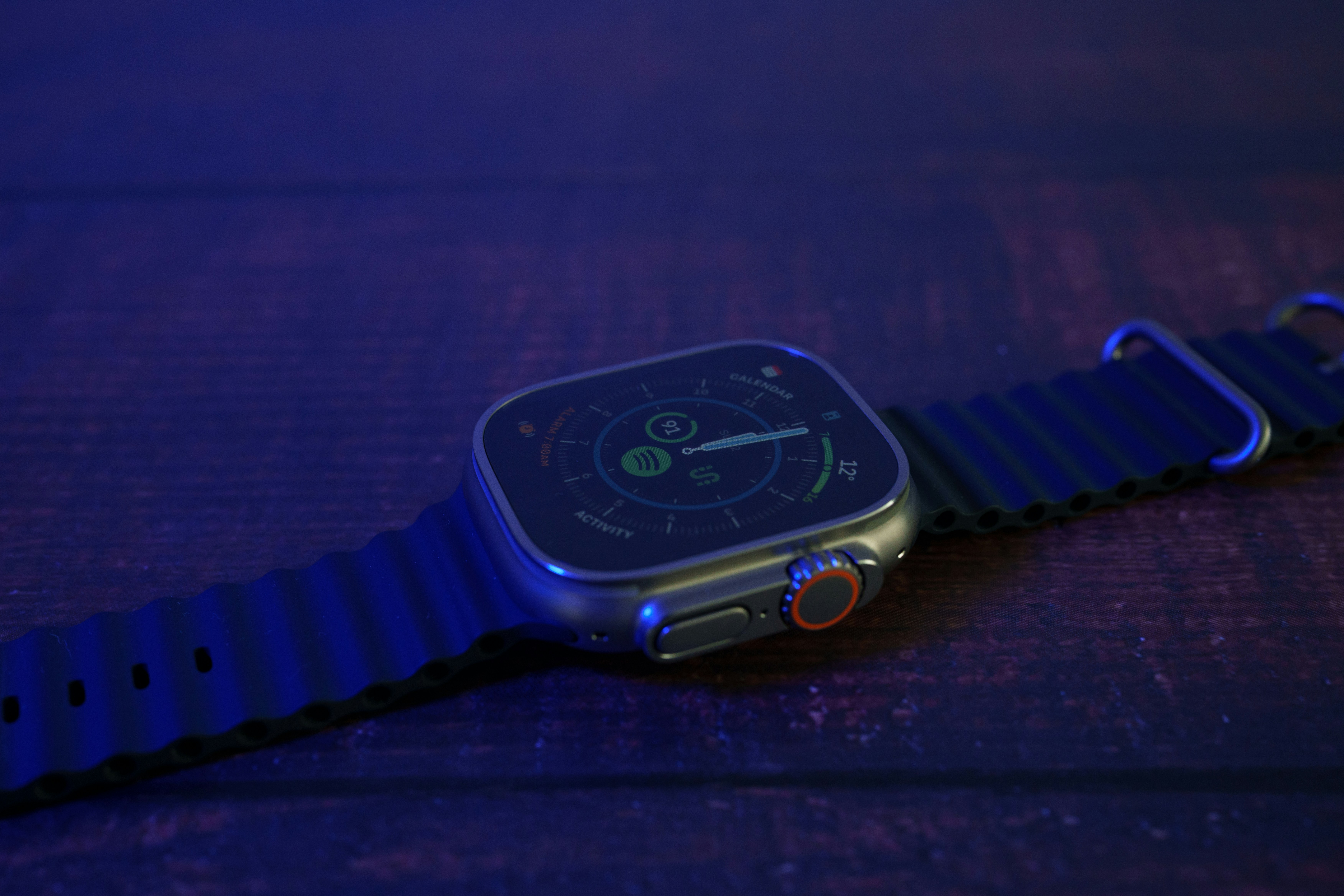 a watch on a blue surface