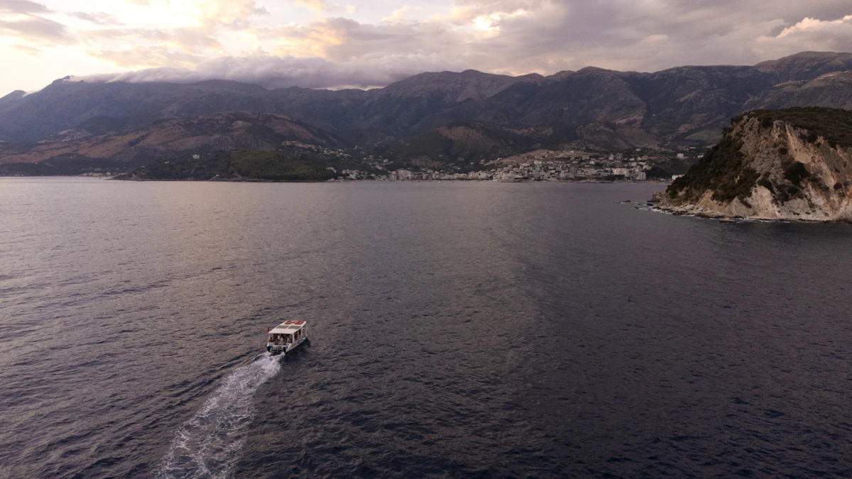 Himarë Ionian cove — local coastal rental beats dragging a Tirana pickup through a long first day