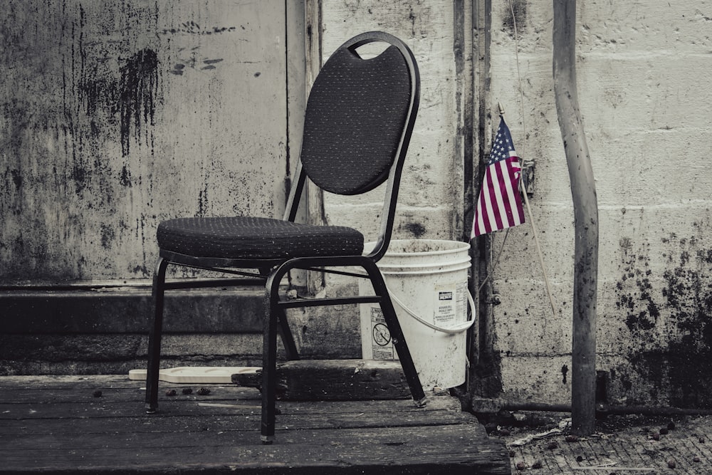 a chair and a trash can