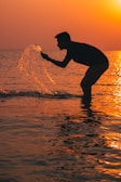 a man surfing in the sea