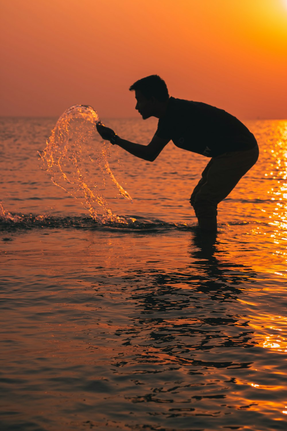 a man surfing in the sea