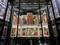 Detailed view of a rare painted panel illustrating biblical scenes from the pre-reformation era.