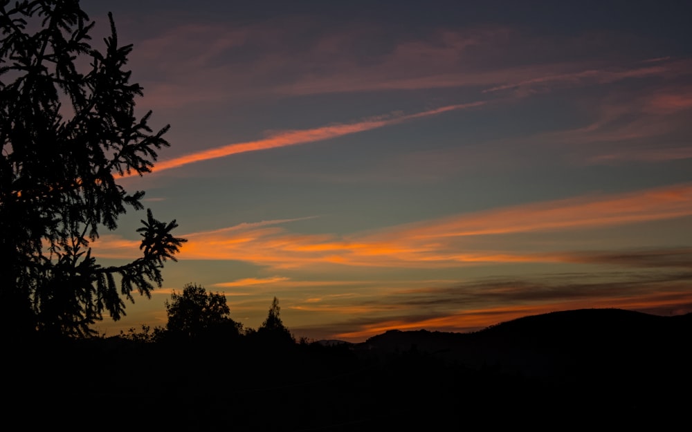 a sunset over a mountain range