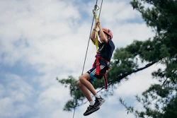 a man on a zip line