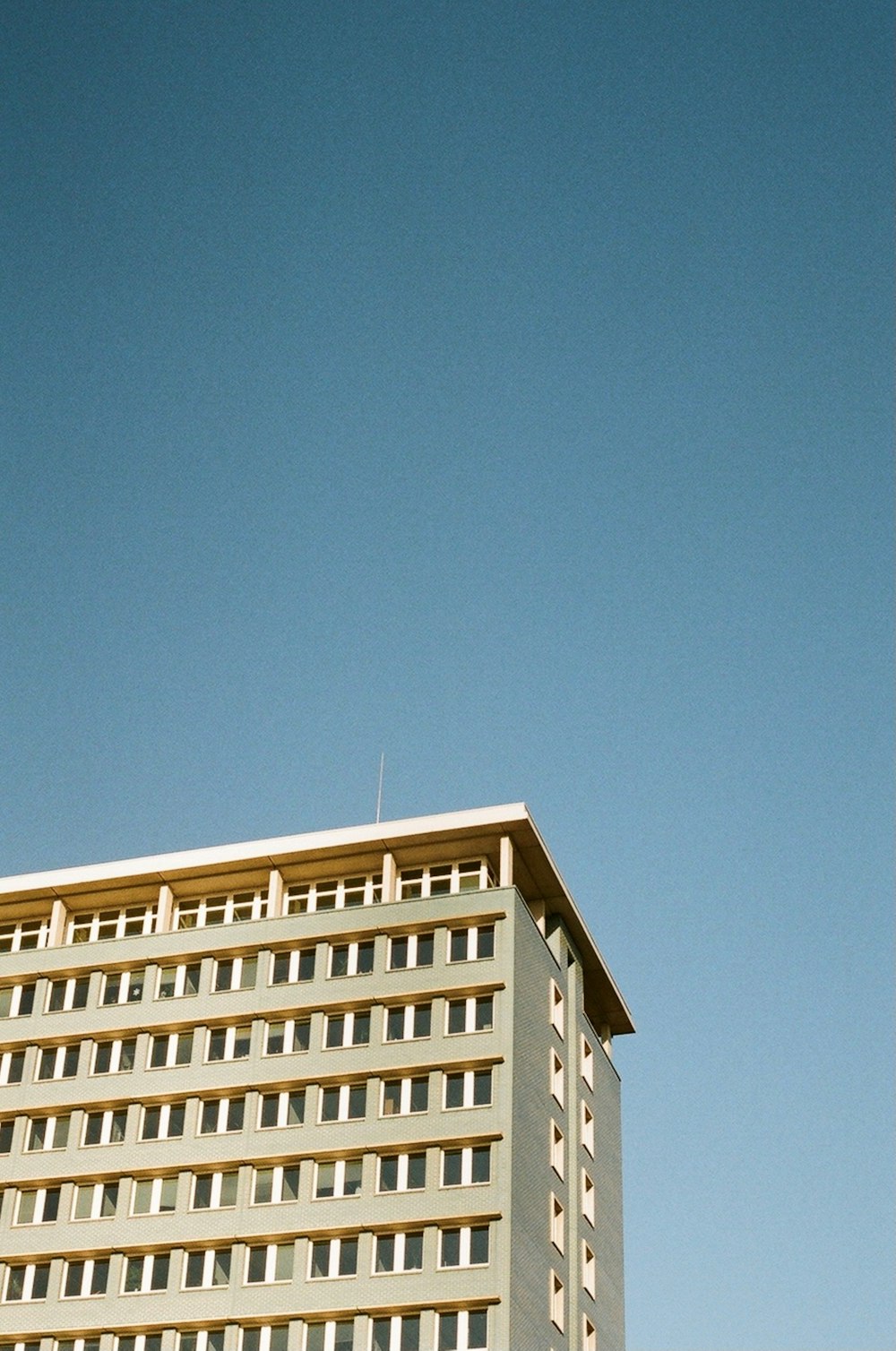 a tall building with a blue sky