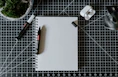 a pen and a notebook on a table