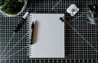 a pen and a notebook on a table