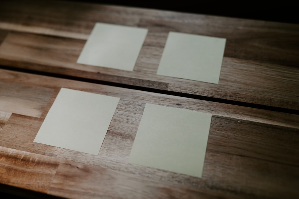 a group of white cubes on a wooden surface