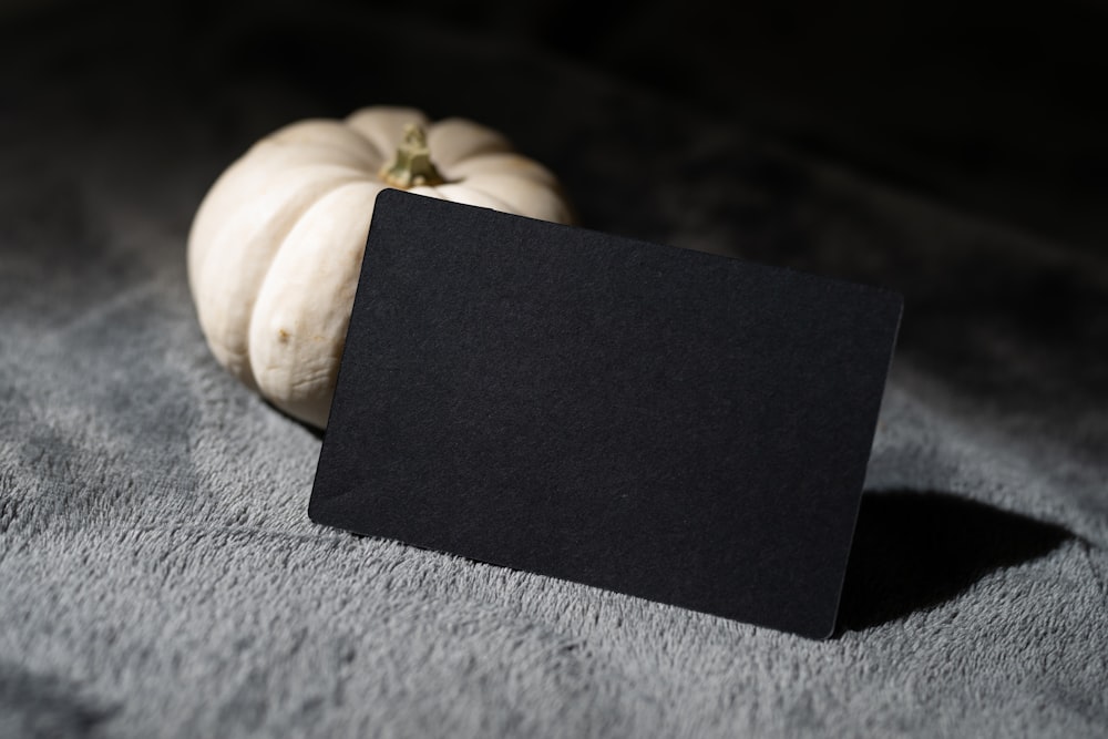 a black napkin with a white object on it