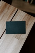 a blue square object on a wooden surface