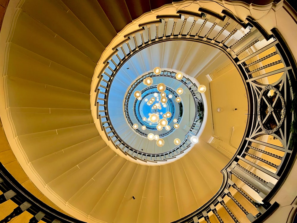 a spiral staircase with a circular window