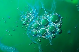 Silver nanoparticles suspended in liquid, illustrated with a subtle 432Hz soundwave overlay.