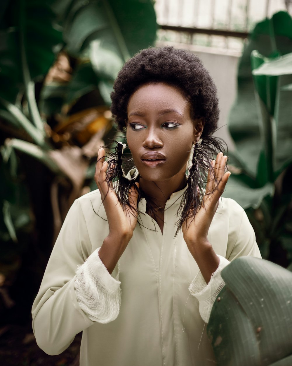 a woman with her hands on her head