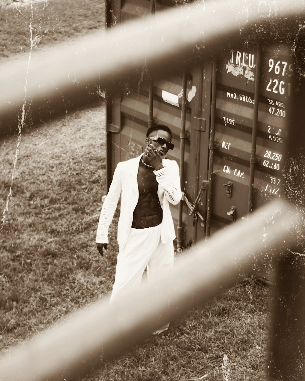 a man standing in front of a sign