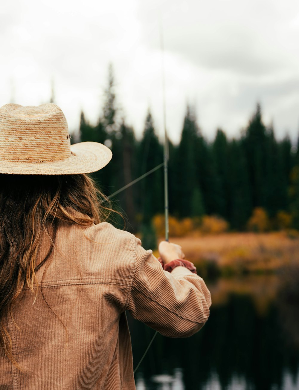 a person holding a fishing pole