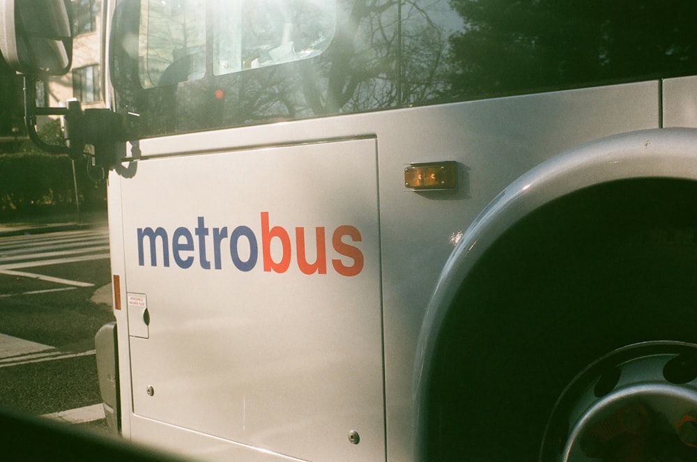 a white vehicle with a sign on it