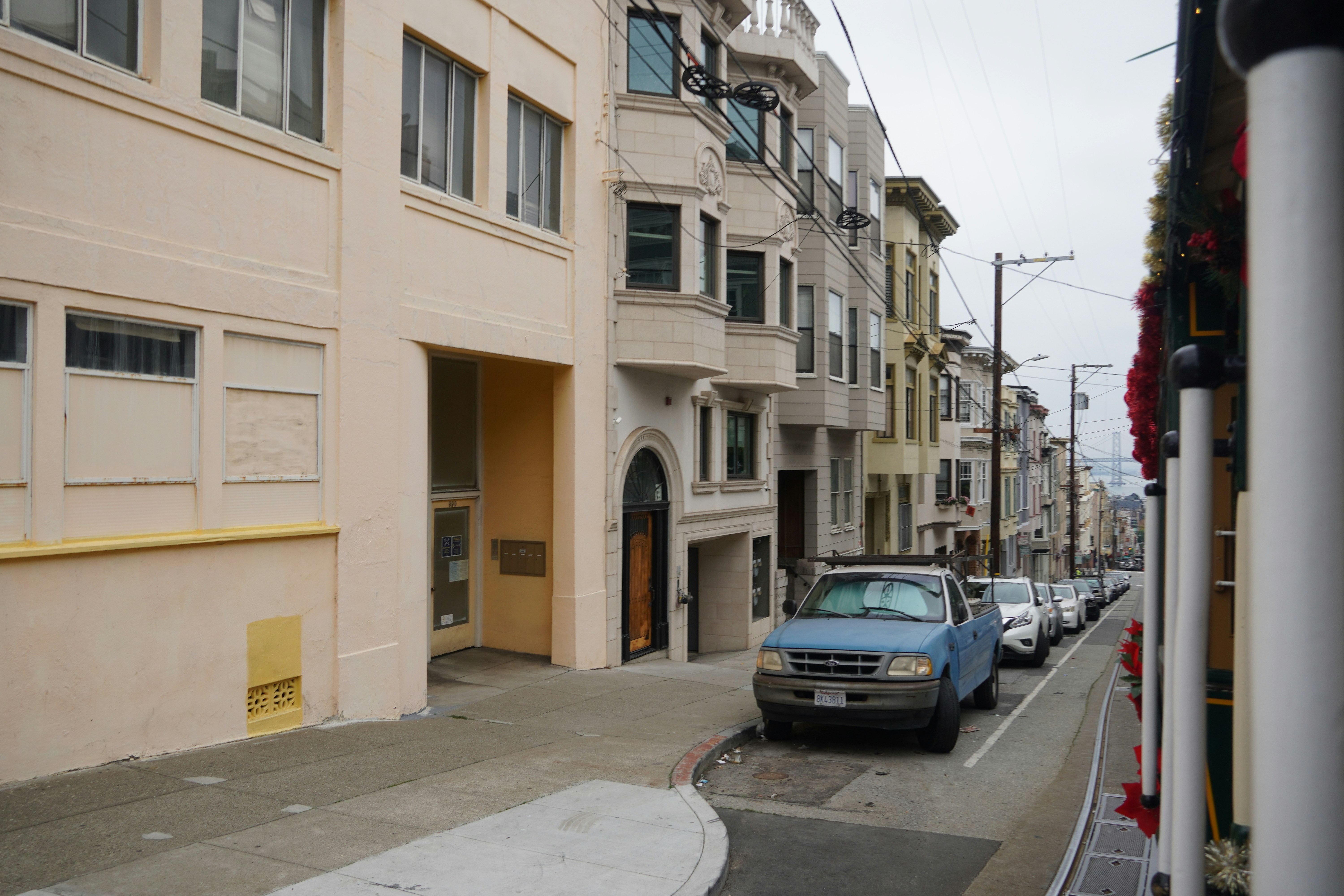 a street with cars parked on the side