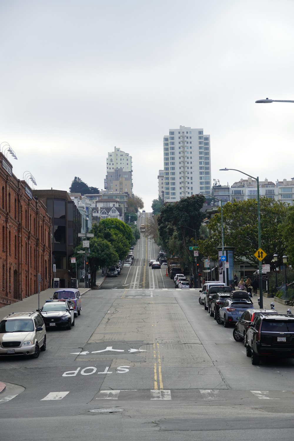 a street with cars and buildings on the side