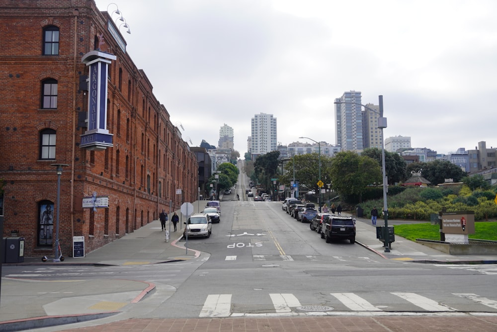 a street with cars and buildings on the side