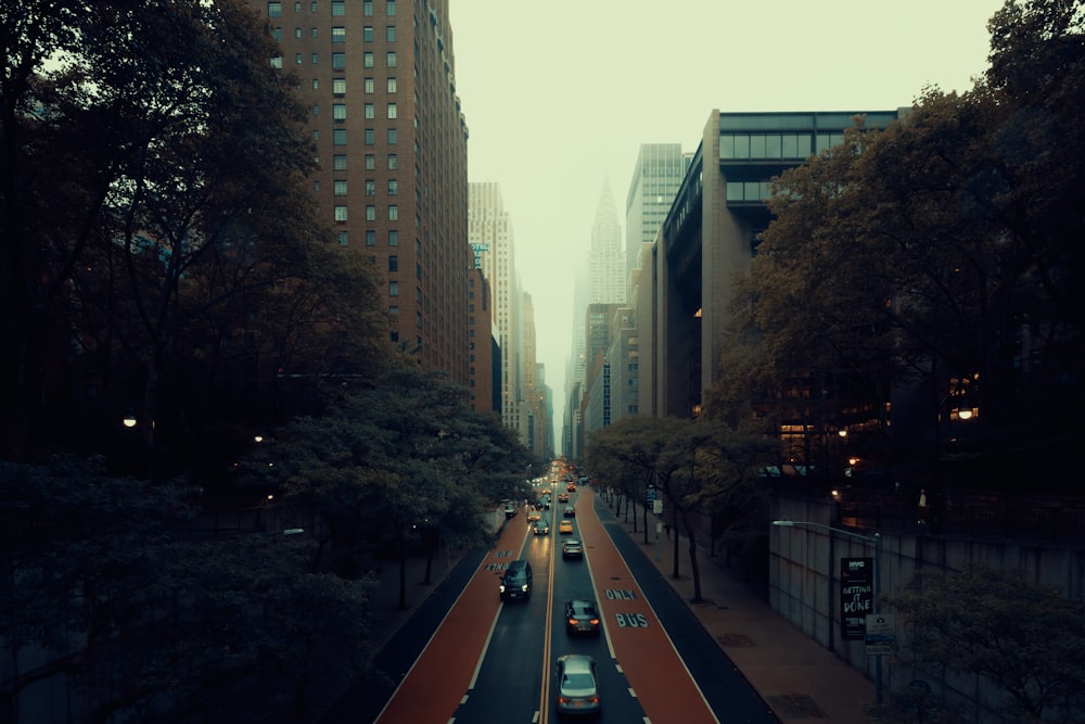 a street with cars on it and buildings on the side