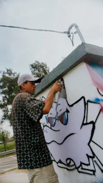 a person painting a wall