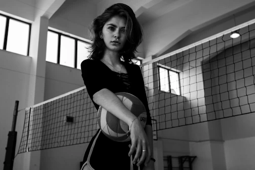 Dynamic volleyball club training session under dramatic lighting emphasizing teamwork and energy.