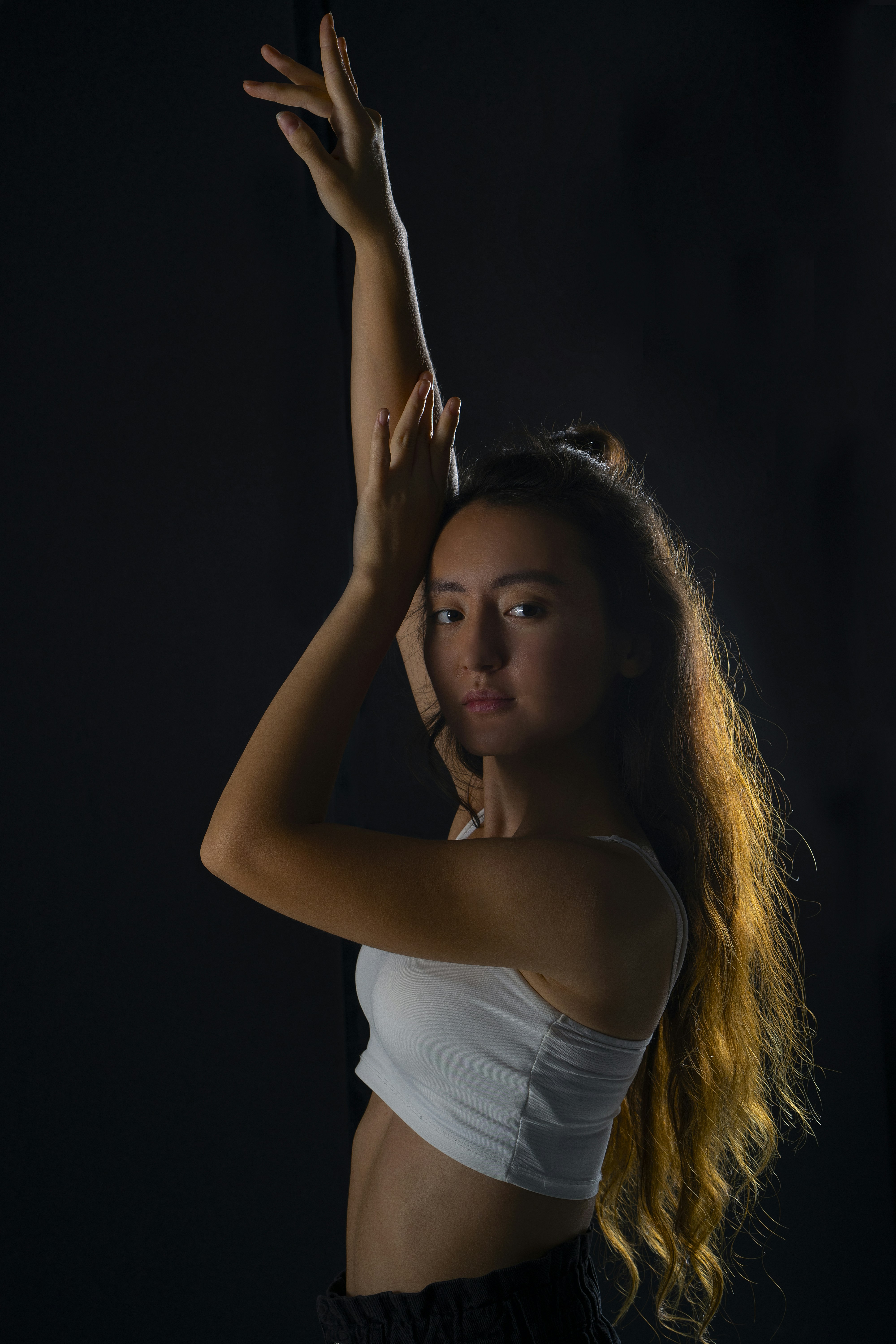 a woman with her hands up
