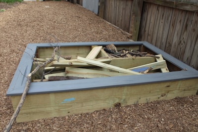 Step-by-step display of creating a garden frame from raw materials to finished piece.