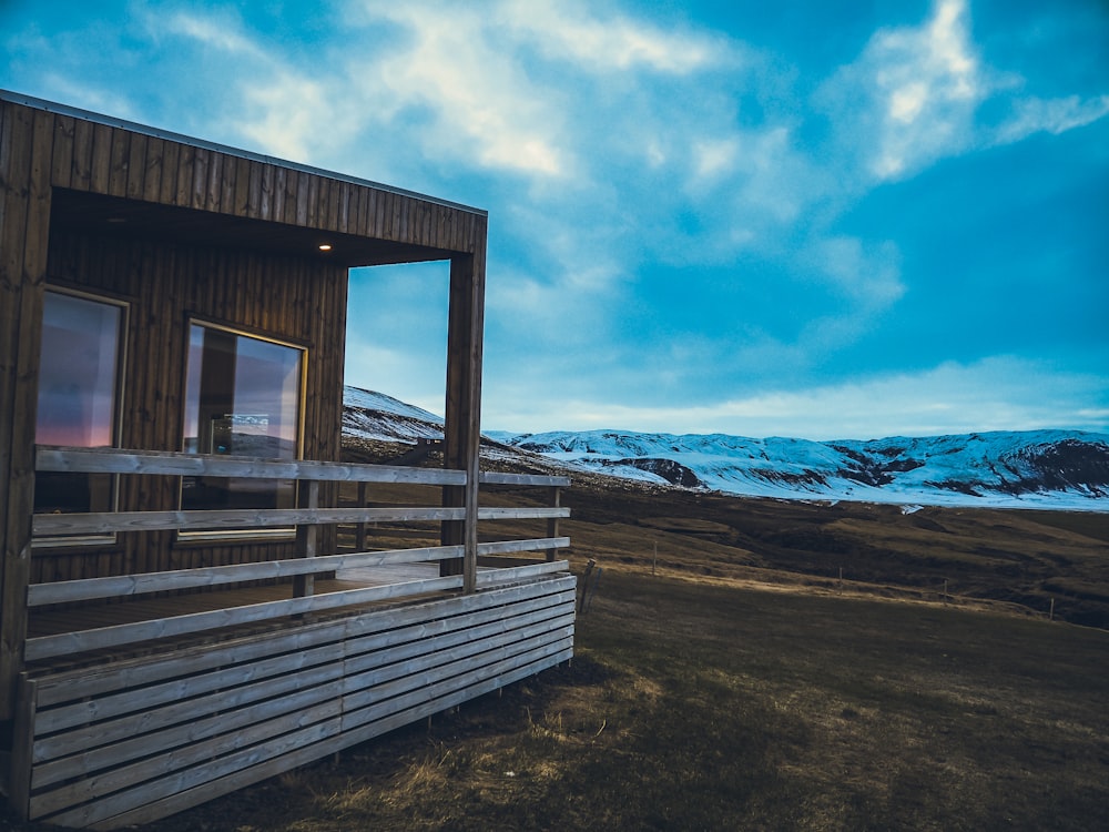 a wooden building with a snowy landscape