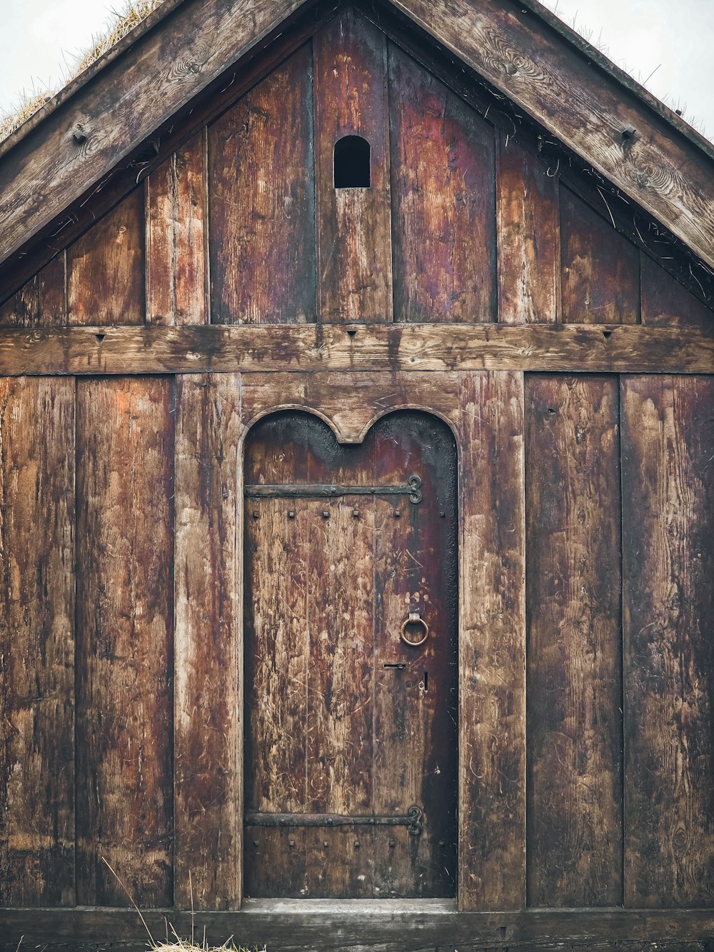 a wooden building with a door